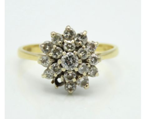 An 18ct gold diamond cluster ring, approx. 0.66ct of diamonds, lacking one stone, 3.6g, size P