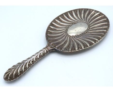 A decoratively mounted 1887 Victorian London silver vanity mirror by William Comyns & Sons, 290mm long 