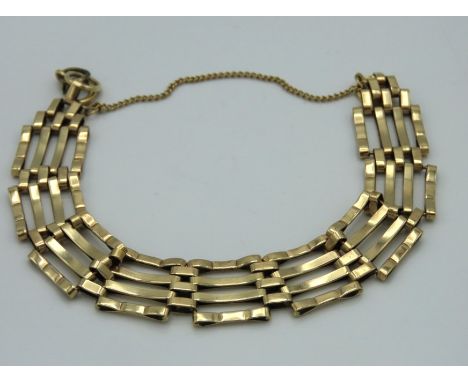 A 9ct gold four bar gate bracelet, clasp a/f, 14.5g