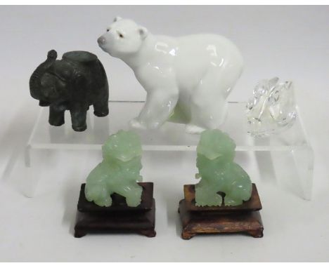 A Lladro polar bear, a pair of jade foo dogs, a bronze style elephant & a Swarovski crystal swan