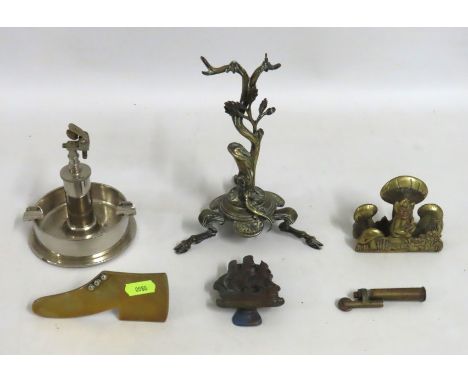 A WW2 brass shell & bullet table lighter, later chromium plated, a trench art pipe rest, a WW1 trench art lighter, a pixie & 