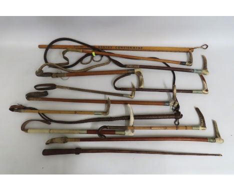 A silver collared hunting whip twinned with a selection of horse riding crops/whips & a 'Lean on Tom Gentry' walking cane mea