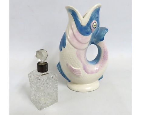 A Dartmouth pottery glug glug jug, 230mm tall, twinned with a silver topped scent bottle, stopper a/f