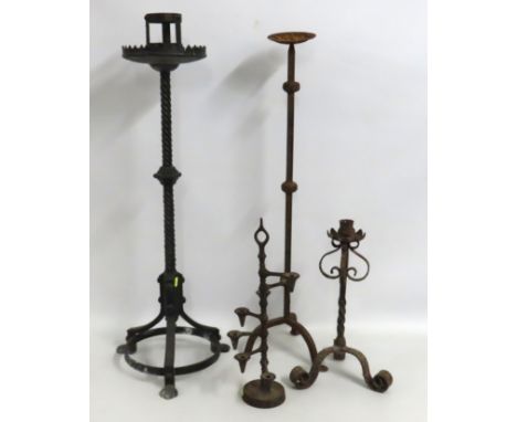 A substantial ecclesiastical, Gothic wrought iron candle holder twinned with three others, tallest 940mm to include a wrought