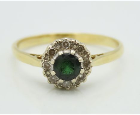 A 9ct gold ring set with diamond & possibly garnet, main stone is abraided, 3g, size R