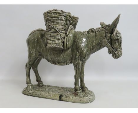A large 19thC. Delphin Massier Vallauris style majolica pottery model of a donkey, impressed number to base, some repairs to 