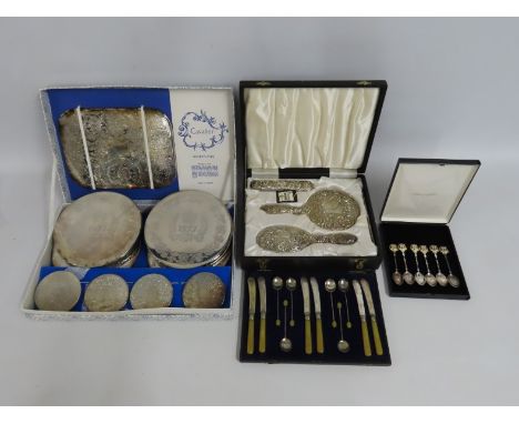 A boxed four piece Broadway & Co. 1972 Birmingham silver dressing table set comprising hair brush, clothes brush, mirror & co