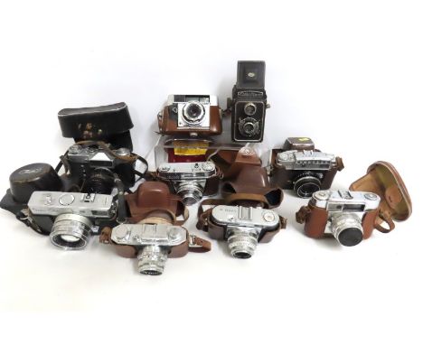 A selection of various film cameras including Voigtlander, Halina 35X, Ricoh Super Shot, Zenit-E, Taron & others