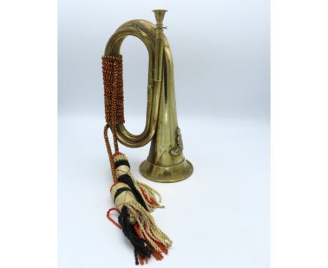 A brass military bugle with Argyll & Sutherland motive, 280mm tall