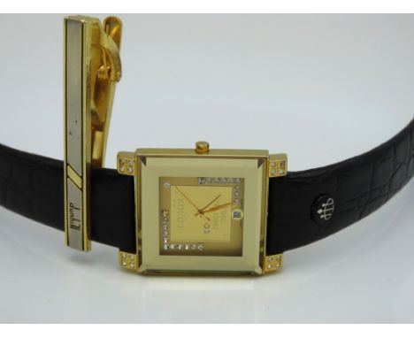 A Dunhill tie clip twinned with a Lobor gents wristwatch with .999 gold ingot to dial