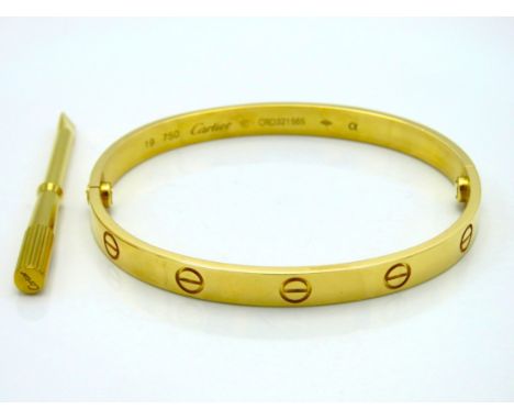 An 18ct gold Cartier 'Love' bangle with original screwdriver, internal measurement 57mm x 51mm, size 19, 31.7g