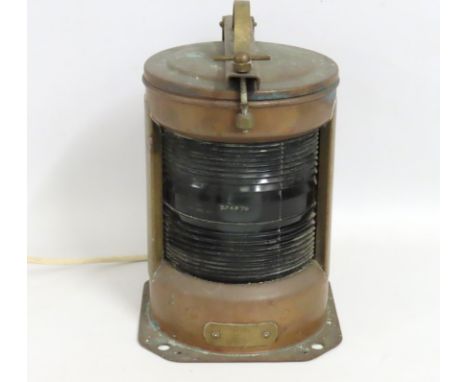 An early 20thC. copper stern nautical lamp with electrical fitting, 340mm tall