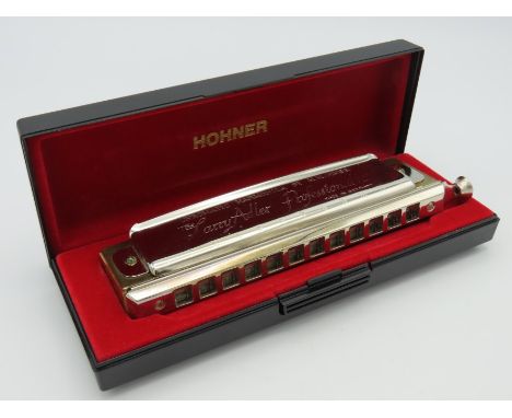 A cased Hohner chromatic harmonica, inscribed The Larry Adler Professional 2