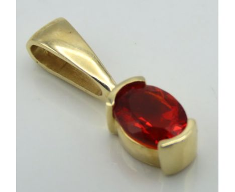 A 14ct gold pendant set with fire opal, 21mm drop, 1.8g