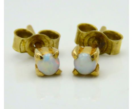 A pair of yellow metal opal earrings, test electronically as 9ct gold, 0.7g