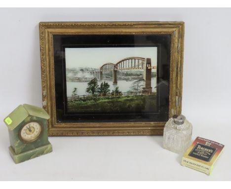 A framed glass print of the Brunel bridge twinned with an onyx clock, a silver topped scent bottle & a small boxed hip flask