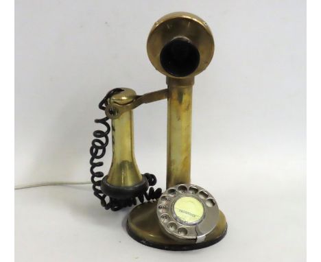 A vintage brass candlestick telephone with four digit Tavistock phone number, wired for modern usage