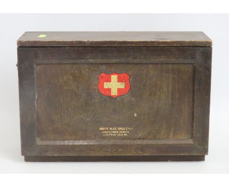 A wooden Boots Drug Company first aid cabinet, 365mm wide x 245mm high x 125mm deep