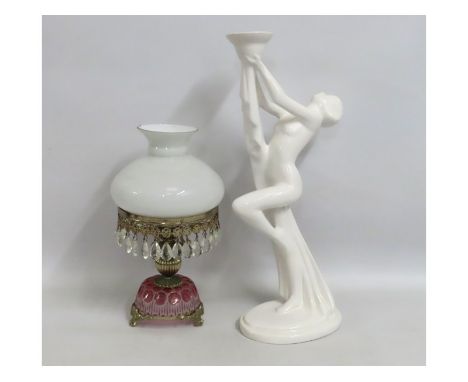 An art deco style porcelain lamp base, 500mm tall, twinned with a smaller decorative lamp, chip to shade & loss of one pendan