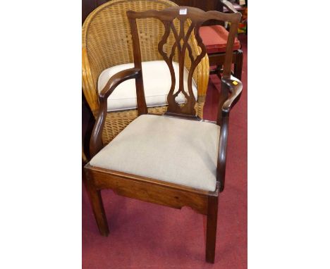 A 19th century mahogany splat back single elbow chair in the Chippendale taste, with grey fabric upholstered dorp-in pad seat