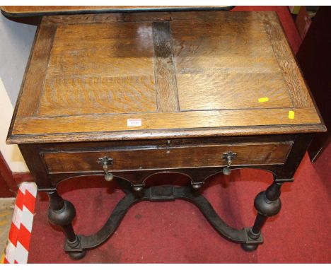 An early 20th century oak single drawer cutlery table, enclosing fitted contents (silver plated), width 74cm