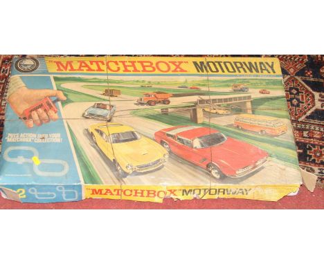 A Matchbox Motorway M-2 slot racing gift set housed in the original box