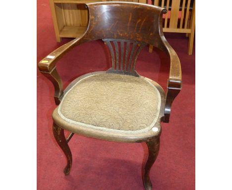 A 1920s oak splat back tub elbow desk chair, having floral tapestry upholstered fixed pad seat, width 60.5cm