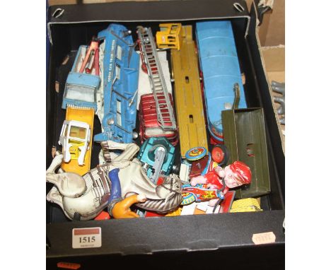 A quantity of vintage diecast and tinplate vehicles and accessories to include a Dinky Toys Joe 90 supercar etc