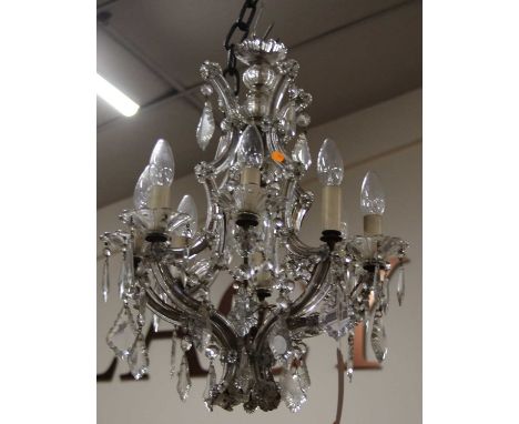 An early 20th century cut crystal dropped glass hanging eight light electrolier (one upper sconce missing), approx drop 60cm