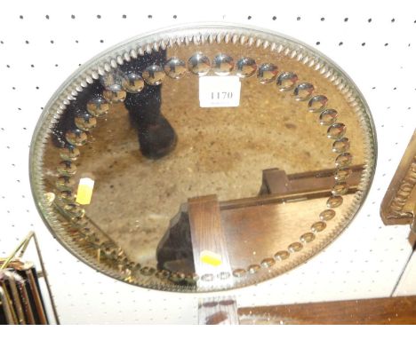 An early 20th century Irish circular wall mirror, having beaded inner detail, dia. 33cmSome light scratches and marks, but ve