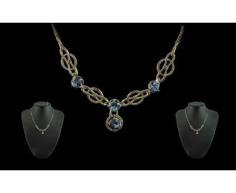 Ladies Attractive 9ct Gold Necklace, set with Aquamarines.  Pleasing design.  Full hallmark for 9.375.  Aquamarine of deep bl