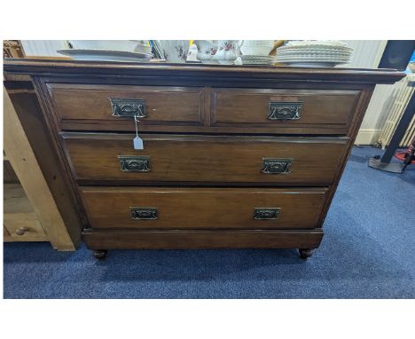 Large Vintage Chest of Drawers, two short above two larger graduating drawers.  Raised on ball feet, with brass decorative ha