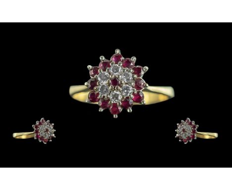 An 18ct Gold Ruby &amp; Diamond Ring, the central Ruby surrounded by brilliant cut diamonds and rubies, ring size P.