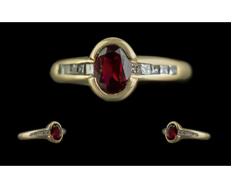 18ct Gold - Attractive Ladies Ruby and Diamond Set Dress Ring. Marked 750 to Interior of Shank. The Oval Faceted Ruby of Good