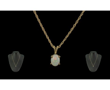 Ladies 9ct Gold - Opal Set Pendant Drop with Chain. Marked 9.375. The Opal of Excellent Colours. Length 20 Inches - 50 cms. E