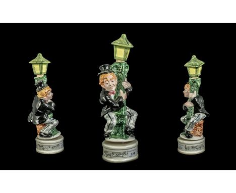 Musical Decanter in the Form of a Drunk Holding on to a Lamp post, measures 14'' tall.