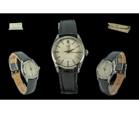 Rolex Oyster Gents Mechanical Steel Cased Wrist Watch, circa 1960.  Features white enamel dial, original Rolex leather watch 