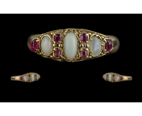 An Antique 18ct Gold Opal &amp; Ruby Ring, three opals set between ruby spacers.