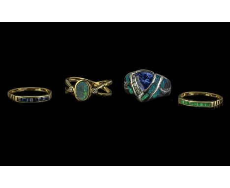 Four 14ct Gold Dress Rings, set with Opal and diamonds, Opal, diamonds and Tanzanite, Emeralds and Sapphires.  Gross weight 1