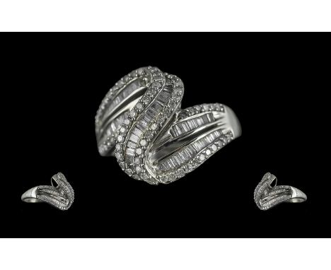9ct White Gold Diamond Cluster Ring, set with tapered baguette and round brilliant cut diamonds.  Fully hallmarked, ring size