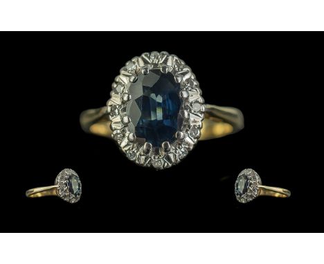 18ct Gold Sapphire &amp; Diamond Cluster Ring, central sapphire surround by diamonds.  Stamped 18ct.  Ring size L.