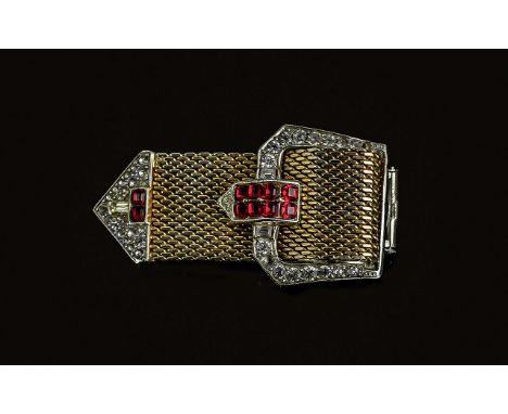 Art Deco Style Clasp Brooch, stamped Boucher 7309, decorated with faux diamond and ruby stones and tri-coloured gold metals. 