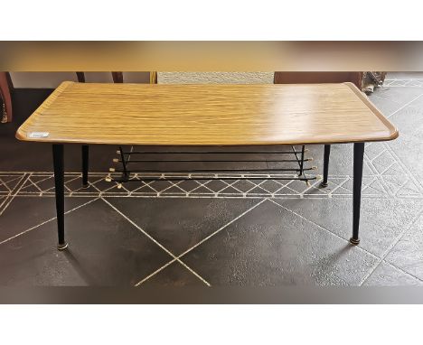 1950's Coffee Table, formica top, black tapering legs with enamelled magazine shelf.  Height 14'' x length 36'' x depth 16''.