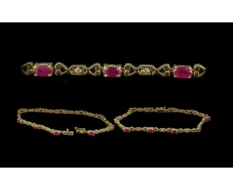 A 14ct Ruby &amp; Diamond Bracelet, alternately set oval cut rubies and round cut diamonds.  Stamped 14ct.  Gross weight 14 g