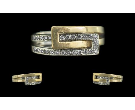 18ct Yellow Gold Excellent Quality Contempory Design Diamond Set Buckle Ring - Marked 750 (18ct) To shank. The two Rows Of Di