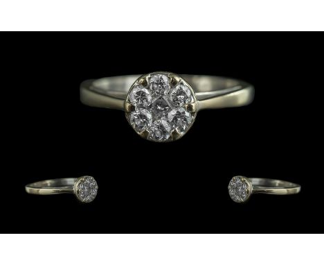18ct White Gold Seven Stone Diamond Set Cluster Ring, full hallmark to interior of shank.  The seven round faceted diamonds o