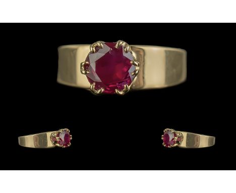 18ct Gold - Pleasing Quality Single Stone Ruby Band Ring. Marked 18ct - 750. The Faceted Ruby of Good Colour. Est ruby Weight