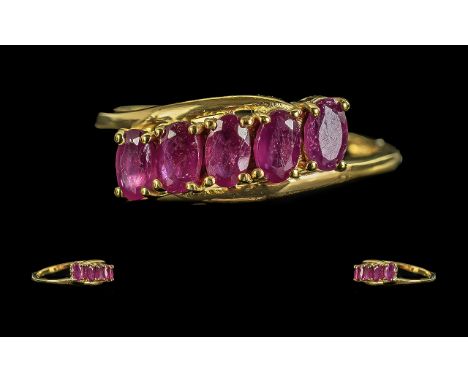 Ruby Five Stone Ring, five oval cut rubies, set slightly at an angle, in a close row across the finger, held in place by a fi