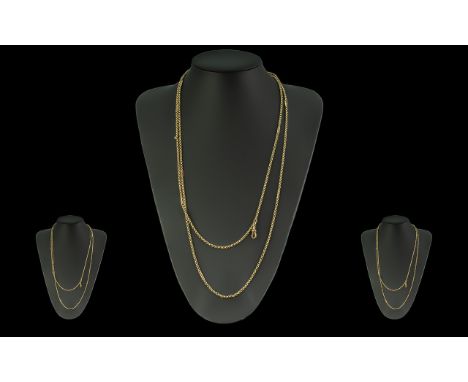 Victorian Period 1837 - 1901 Excellent 9ct Gold - Ladies Muff Chain. Marked 9ct. Pleasing Design. Length 56 Inches - 140 cms.