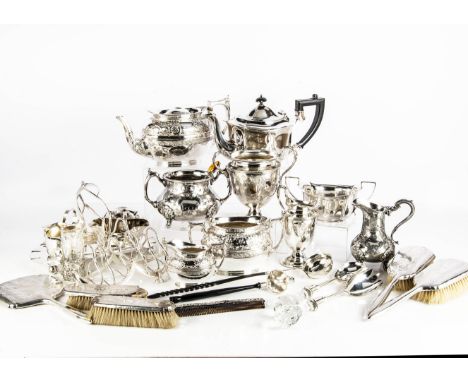 A collection of silver and silver plate, including a toddy ladle with Queen Anne shilling inset to well, dressing table items